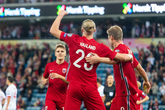 Martin Ødegaard and Alexander Sørloth celebrate with