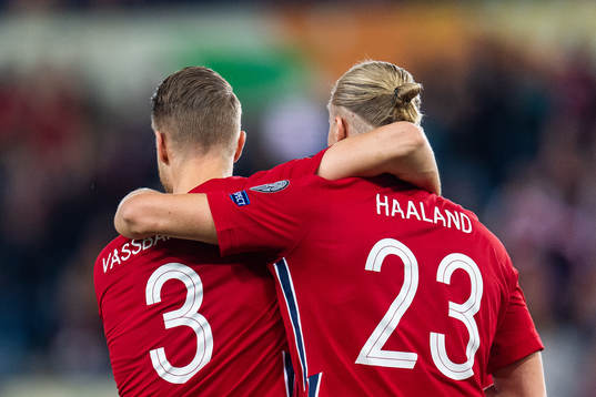 Kristoffer Ajer celebrates with Erling Braut Haaland who