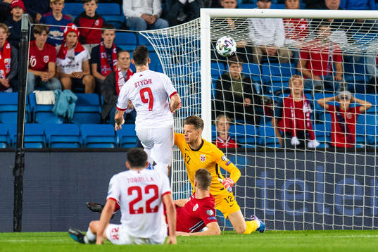 Reece Styche of Gibraltar scores 3-1 behind goalkeeper