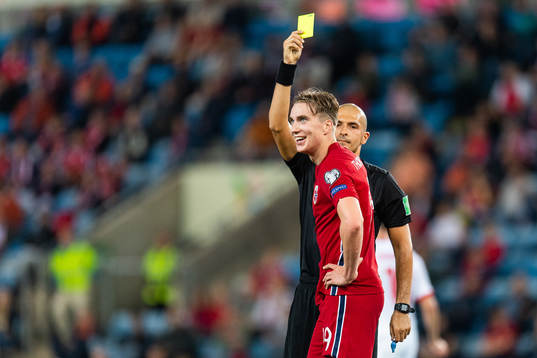 Kristian Thorstvedt of Norway is receives a yellow card