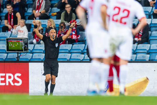 Nikolas Neokleous, referee, calls for a VAR review for a