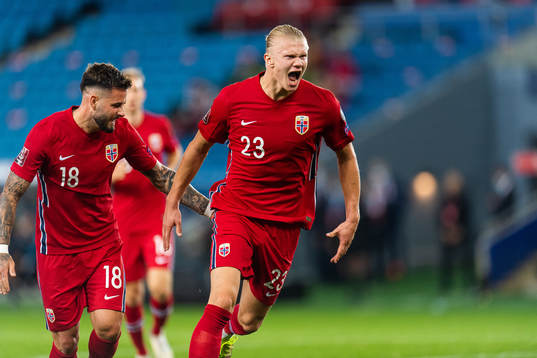 Aron Dønnum celebrates with Erling Braut Haaland of Norway