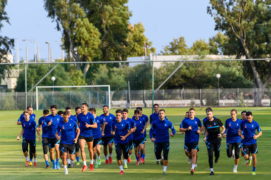 Players of the Greek national football team warm  up