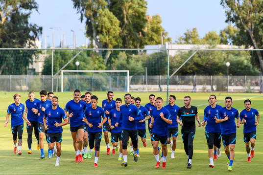 Players of the Greek national football team warm  up
