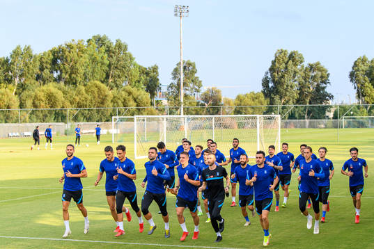 Players of the Greek national football team warm  up