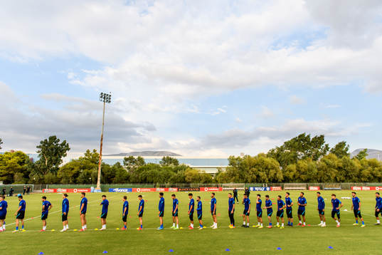 Players of the Greek national football team warm  up