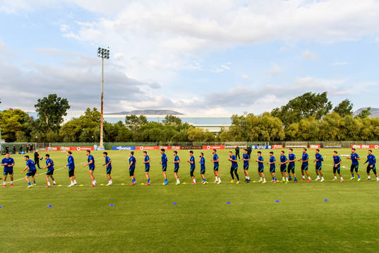 Players of the Greek national football team warm  up