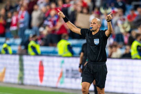 Nikolas Neokleous, referee, denies a penalty