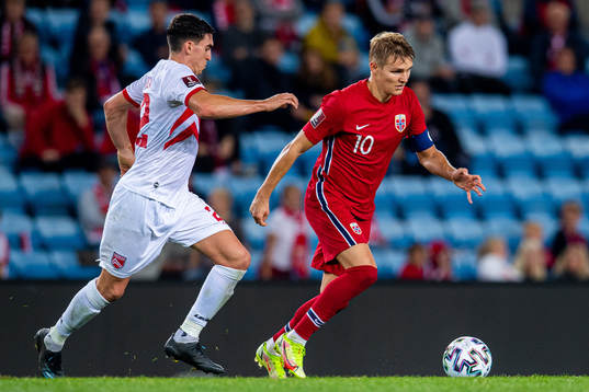Graeme Torrilla of Gibraltar and Martin Ødegaard of Norway