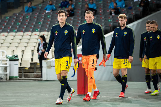 Victor Nilsson Lindelöf and goalkeeper Robin Olsen of