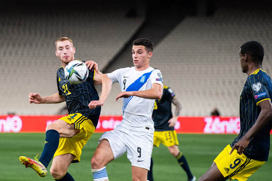 Dejan Kulusevski of Sweden and Anastasios Douvikas of Greece