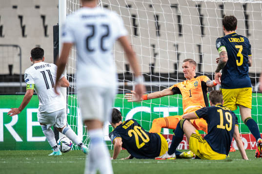 Tasos Bakasetas of Greece score the 1-0 goal behind