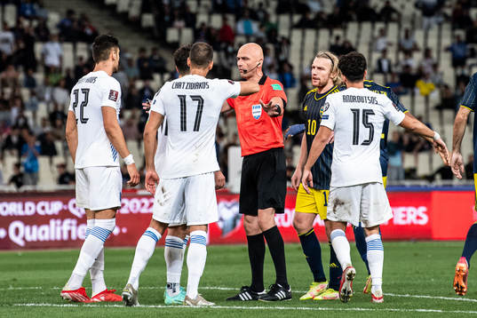 Referee Sergei Karasev and Emil Forsberg of Sweden