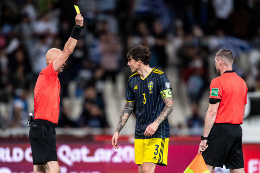 Victor Nilsson Lindelöf of Sweden receives a yellow card