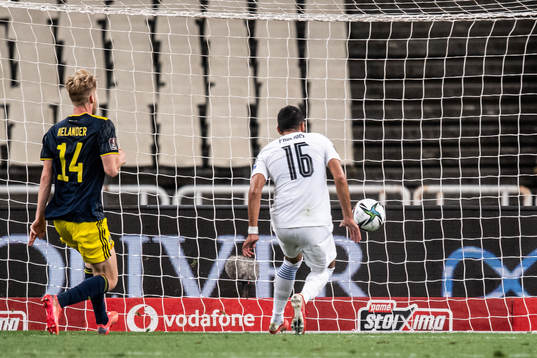 Vangelis Pavlidis of Greece scores the 2-0 goal in front of