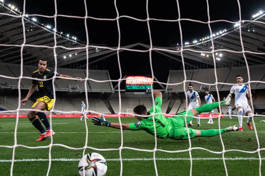 Robin Quaison of Sweden scores the 2-1 goal behind