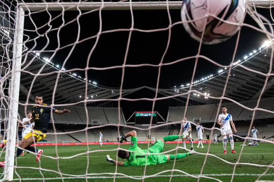 Robin Quaison of Sweden scores the 2-1 goal behind