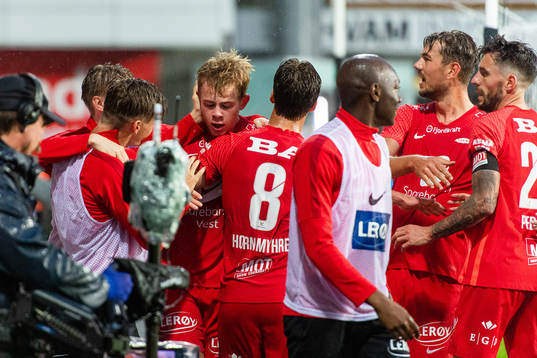 Aune Heggebø of Brann celebrates with team mates