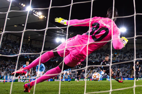 Paulo Dybala of Juventus scores a penalty behind goalkeeper