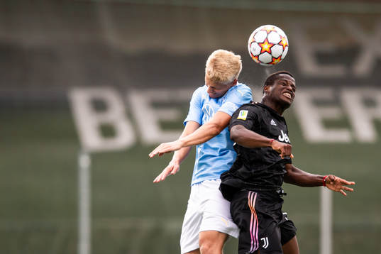 Ludvig Nicklasson of Malmö FF and Ange Josue Chibozo of