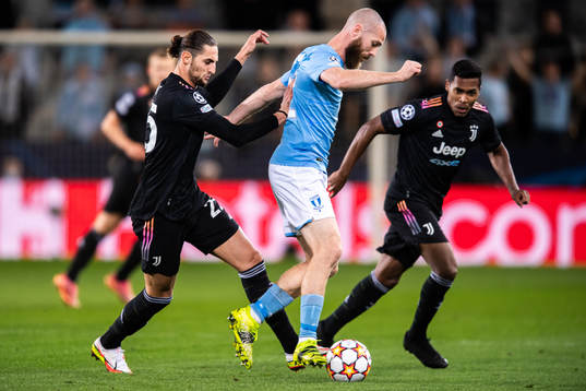 Jo Inge Berget of Malmö FF against Adrien Rabiot and Alex