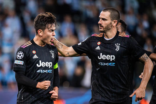 Paulo Dybala and Leonardo Bunucci of Juventus celebrate the