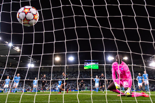 Paulo Dybala of Juventus scores a penalty behind goalkeeper