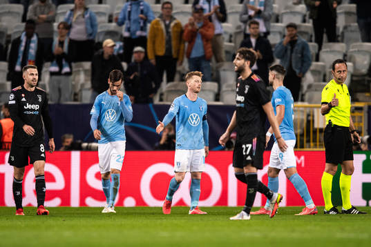 Adi Nalic and Anders Christiansen of Malmö FF look dejected