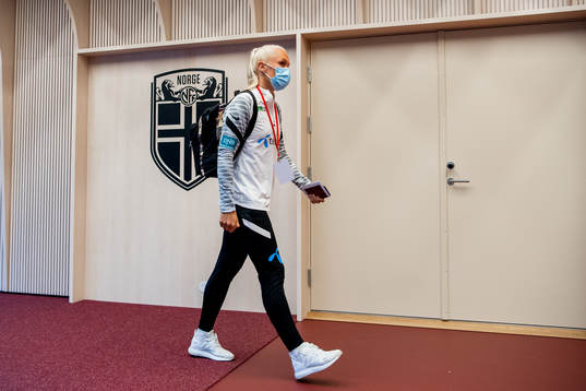 Maria Thorisdottir of Norway arrives wearing a face mask