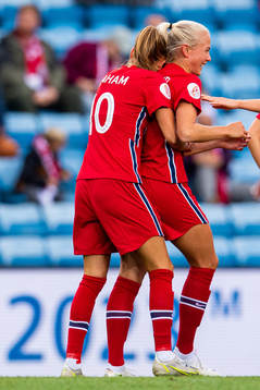 Guro Bergsvand of Norway celebrates with teammate Caroline