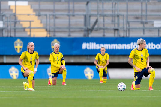 Caroline Seger of Sweden takes a knee in support of the
