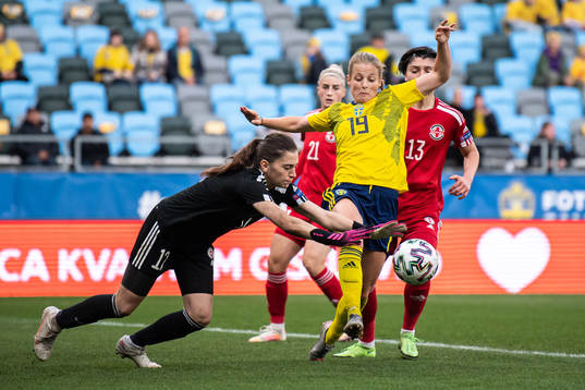 Goalkeeper Tatia abunia of Georgia and Anna Anvegård of