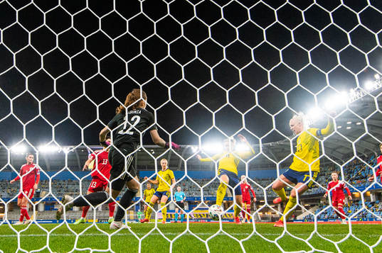 Caroline Seger of Sweden scores 4-0 behind goalkeeper Tatia