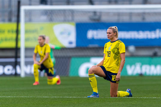 Fridolina Rolfö of Sweden takes a knee in support of the