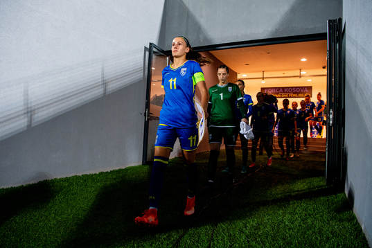 Edona Kryeziu and goalkeeper Florentina Kolgeci of Kosovo