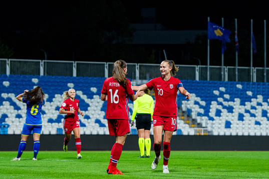 Guro Reiten of Norway celebrates with teammate Caroline