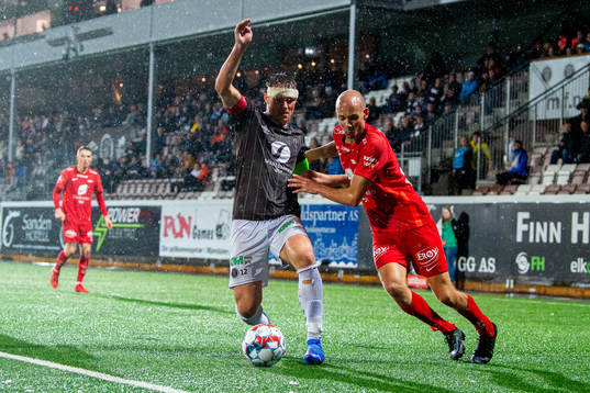 Markus Nakkim of Mjøndalen and Ruben Kristiansen of Brann