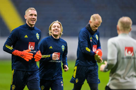 Goalkeeper Robin Olsen and Emil Forsberg of the Swedish