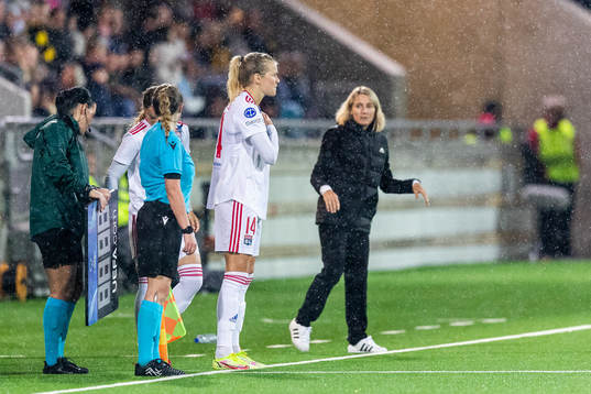 Sonia Bompastor, head coach, watches as Ada Hegerberg of