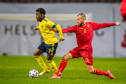 Anthony Elanga of Sweden and Ognjen Obradovic of Montenegro