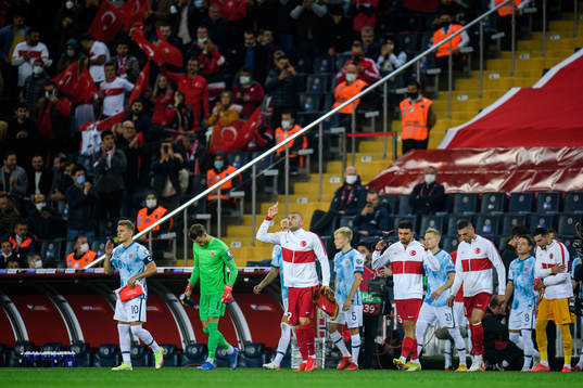 Players of Norway and of Turkey enter the pitch