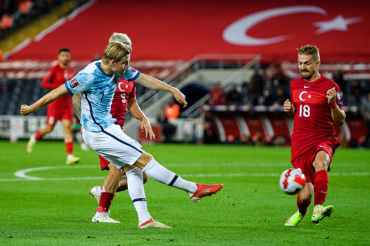Jens Petter Hauge of Norway and Caner Erkin of Turkey
