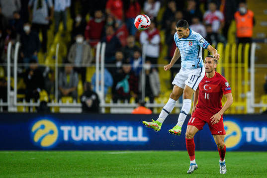 Mohamed Elyounoussi of Norway and Yusuf Yazici of Turkey