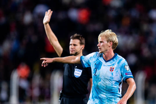Felix Brych, referee, and Morten Thorsby of Norway