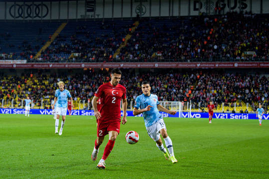 Zeki Celik of Turkey and Mohamed Elyounoussi of Norway
