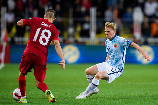 Caner Erkin of Turkey and Mats Møller Dæhli of Norway