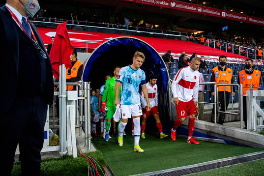 Martin Ødegaard of Norway and Burak Yilmaz of Turkey