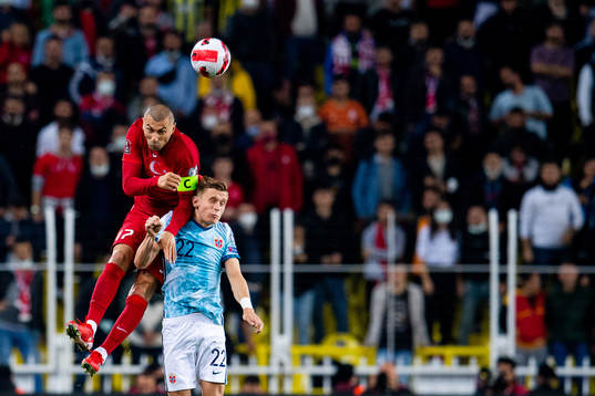 Burak Yilmaz of Turkey and Marcus Holmgren Pedersen of