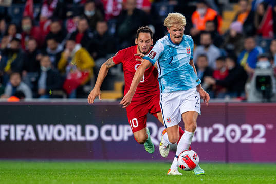 Hakan Calhanoglu of Turkey and Morten Thorsby of Norway