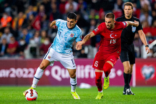 Mohamed Elyounoussi of Norway and Kutlu of Turkey